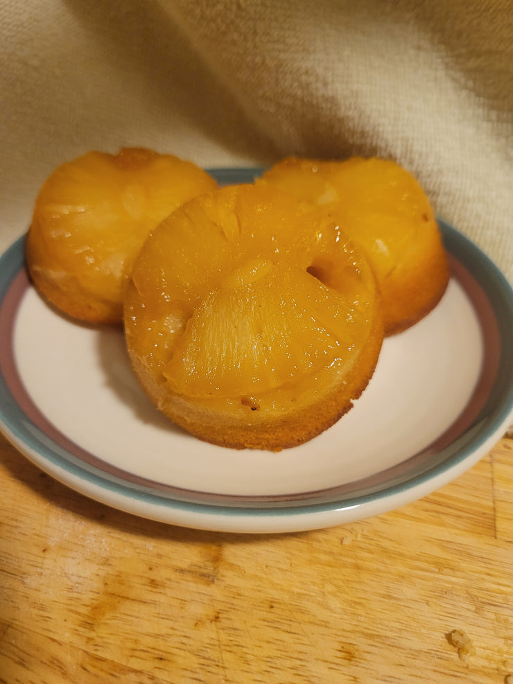 Mini pineapple upside down cakes.